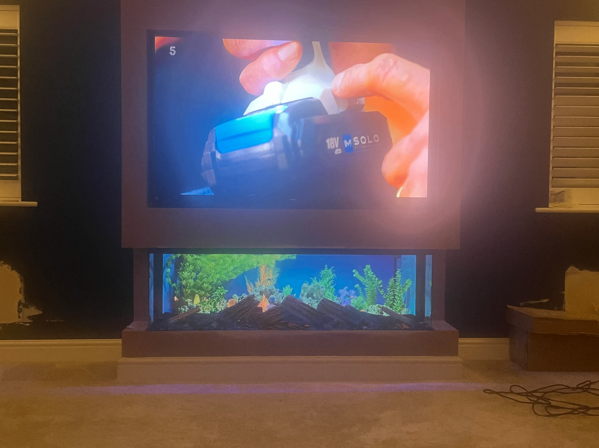 Finished bespoke media wall with TV and media fire installed by Warwickshire Media Walls for Aaron Donaldson